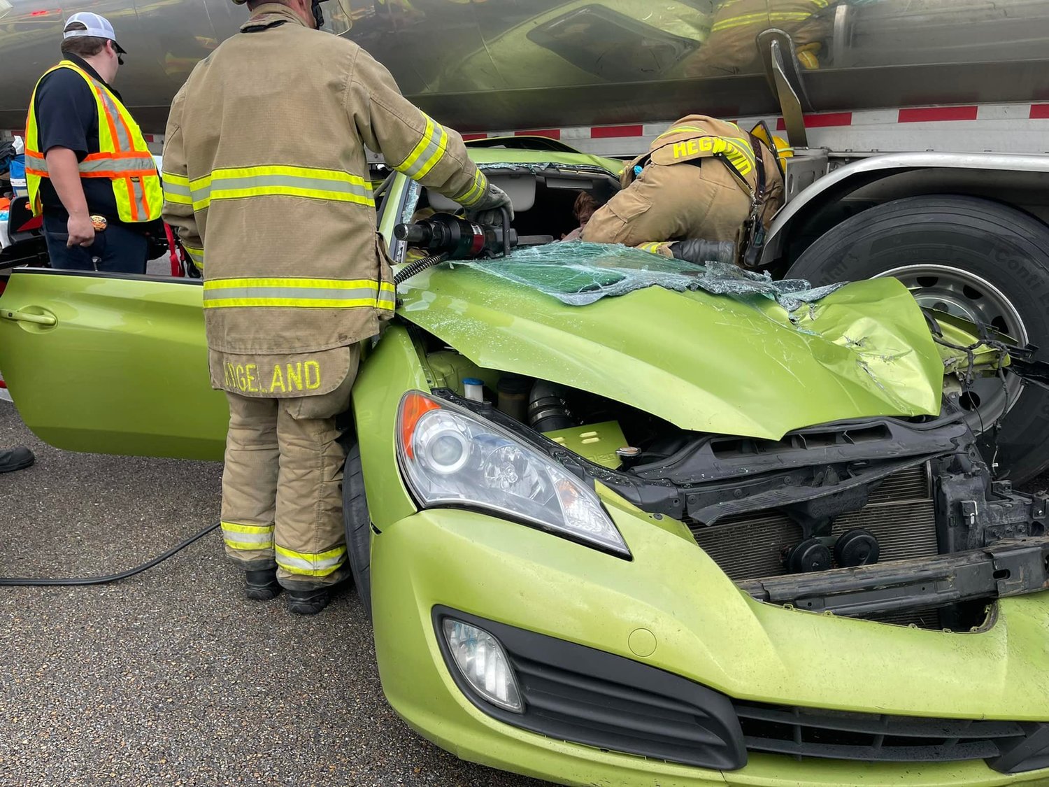 Ridgeland firefighters work to extricate a person trapped under a gasoline tanker Tuesday afternoon on I-55. After what was described as a “very tedious extrication,” the driver was removed and transported to University Mississippi Medical Center, officials said, and only suffered minor injuries.