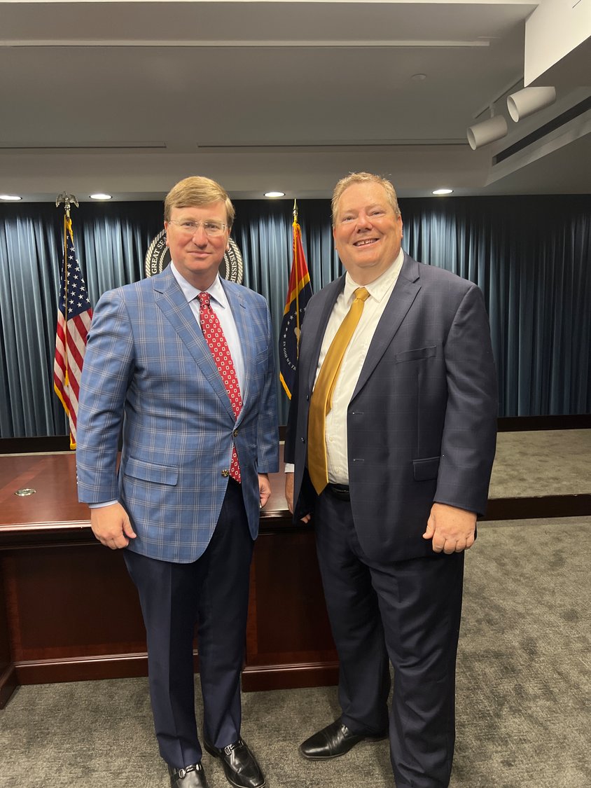 Baptist Children's Village Executive Director Sean Milner (right) stands with Gov. Tate Reeves (left) after Reeves proclaimed May 12 as "The Baptist Children's Village Day." 