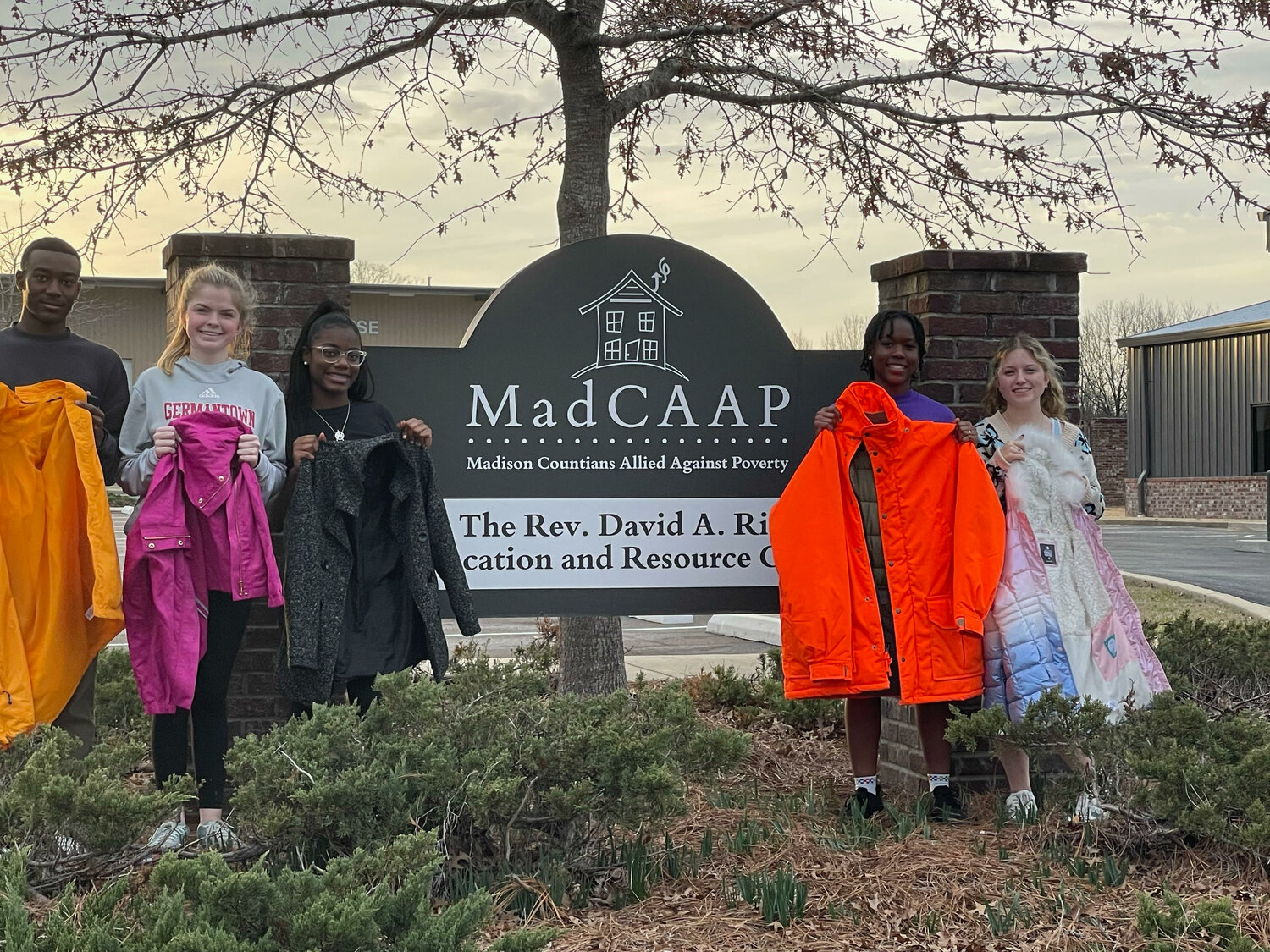 Ashtun Chigbo, Avery Hornback, Miah Schiller, Tytianna Robinson-Course and Julia Lever deliver coats to MadCAAP.